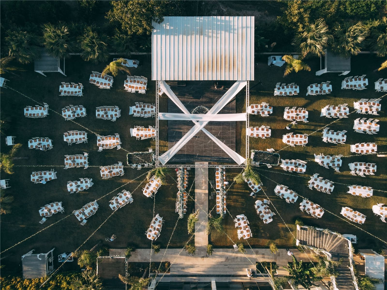 Aerial view of a wedding reception with guests seated at tables